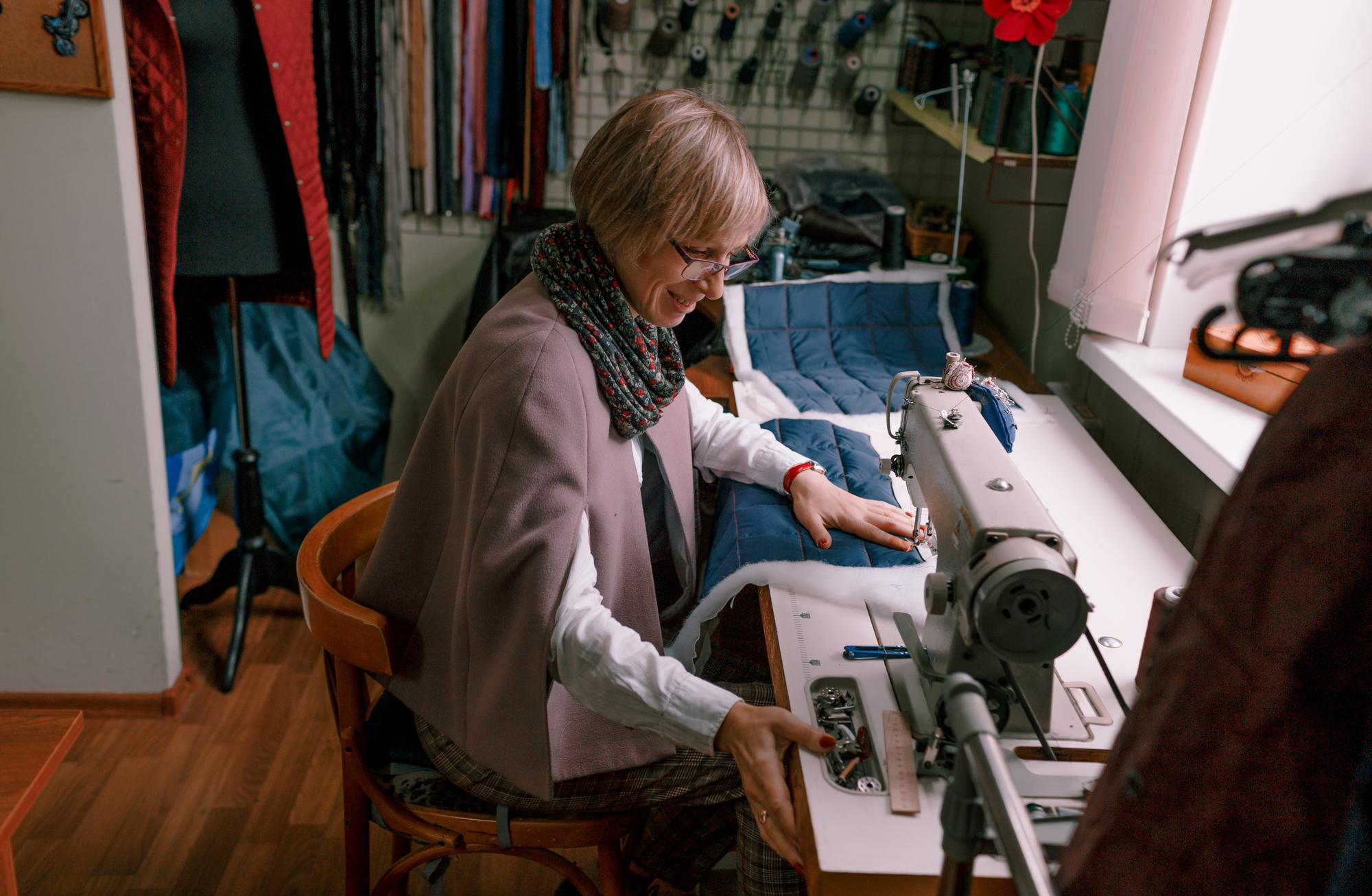 Studio view with embroidery machines and samples